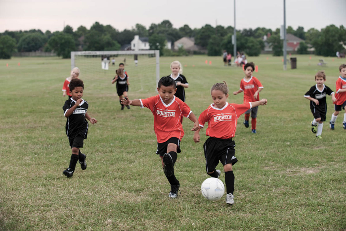 Young kids playing soccer