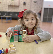 Girl holding toys